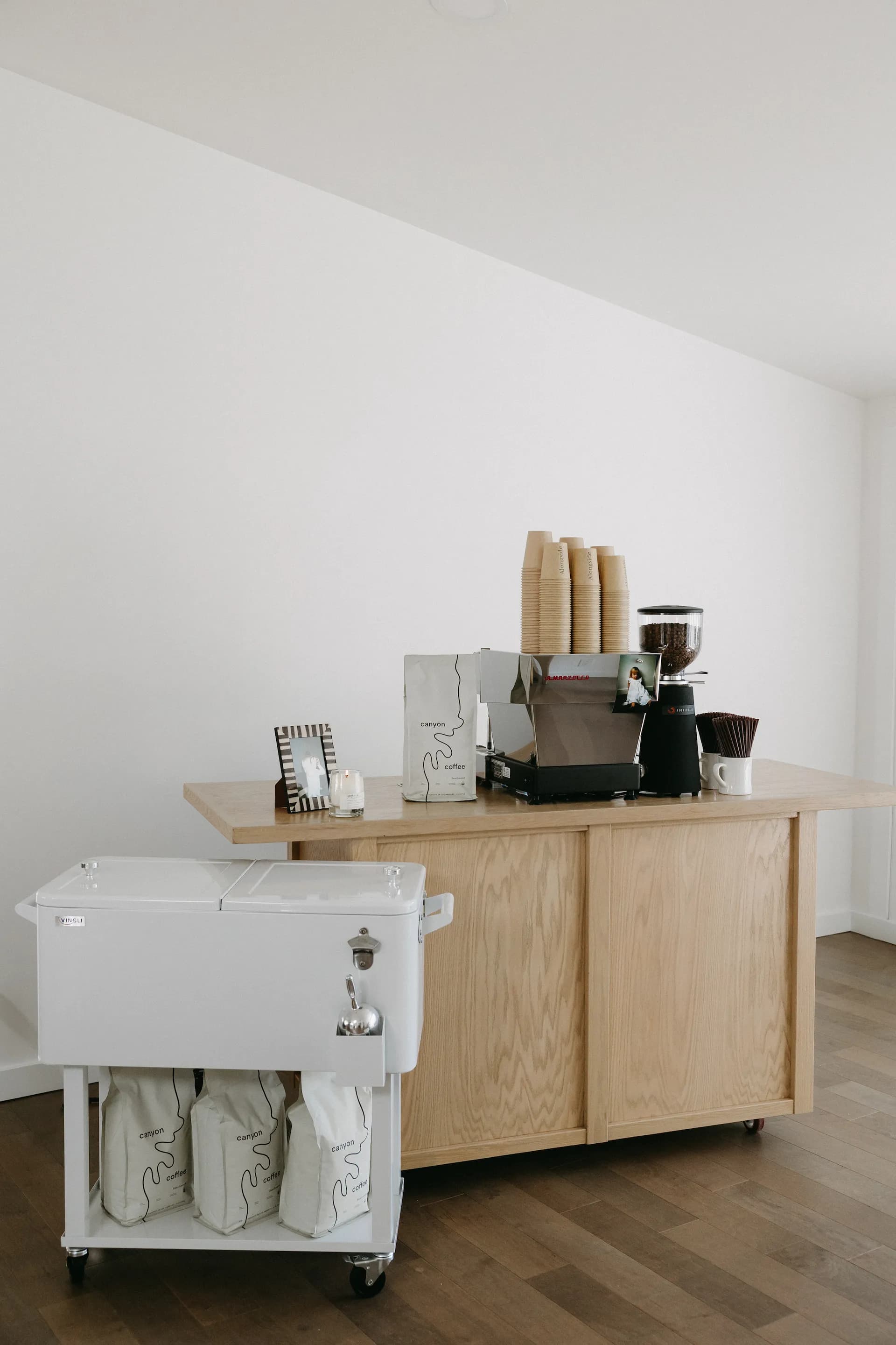 Alongside Coffee's mobile espresso cart — a wood and white bar with a La Marzocco Linea Mini espresso machine