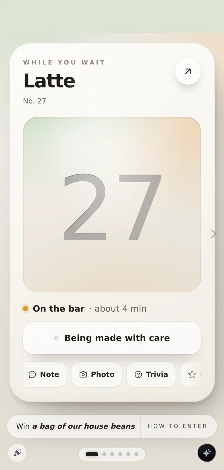 The wait screen in the Bloom glass deck: the number, the timer, the cards behind frosted glass